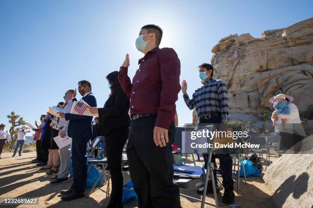 Khoa Du takes the Oath of Allegiance to become a United States citizen during a special outdoor ceremony for 25 new U.S. Citizens at Joshua Tree...