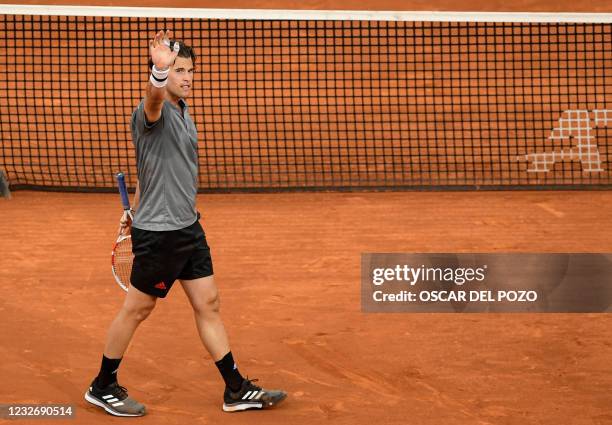 Austria's Dominic Thiem celebrates after beating US Marcos Giron during their 2021 ATP Tour Madrid Open tennis tournament singles match at the Caja...