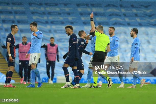 Referee Bjorn Kuipers shows Angel Di Maria of PSG a red card during the UEFA Champions League Semi Final Second Leg match between Manchester City and...