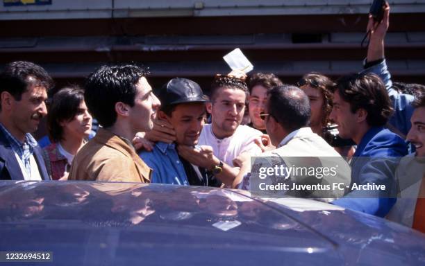 Juventus player Roberto Baggio with fans defore a training session on 1995 in Turin, Italy.