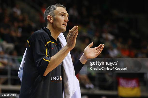 Sven Schultze of Germany applauds his team during the EuroBasket 2011 first round group B match between Italy and Germany at Siauliai Arena on...