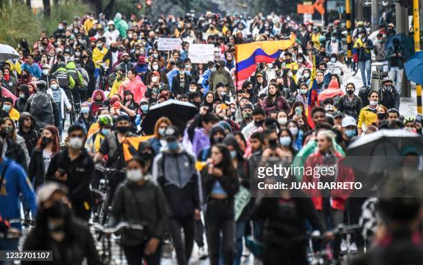 Demonstrators take part in a protest against a tax reform proposed by Colombian President Ivan Duque's government in Bogota, on May 4, 2021. - The...