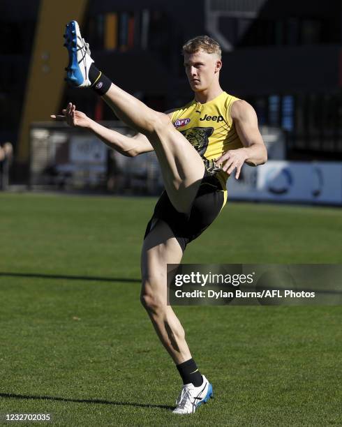 Noah Cumberland of the Tigers kicks the ball during the Richmond Tigers training session at Punt Road Oval on May 05, 2021 in Melbourne, Australia.