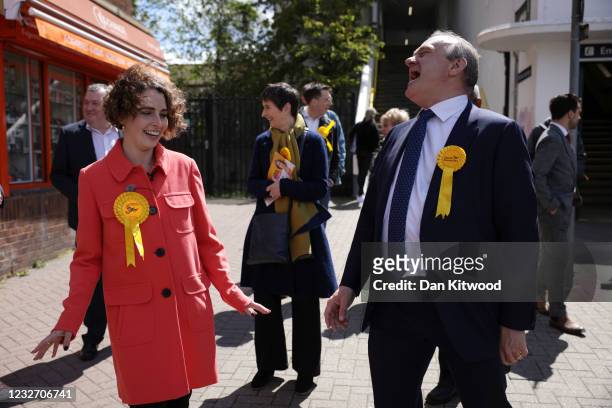 Ed Davey , Leader of the Liberal Democrats and Luisa Porritt, Liberal Democrat Mayoral Candidate laugh as they campaign in Surbiton on May 5, 2021 in...