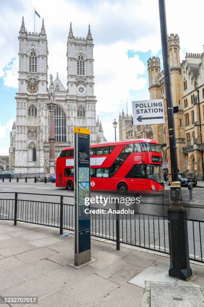 Bus drives past by a polling station placard nearby a polling centre in Westminster, central London, United Kingdom on May 5, 2021. The 2021 London...