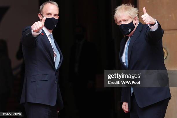 British Prime Minister Boris Johnson poses with Britain's Foreign Secretary Dominic Raab as he arrives for the G7 foreign ministers' meeting on May...