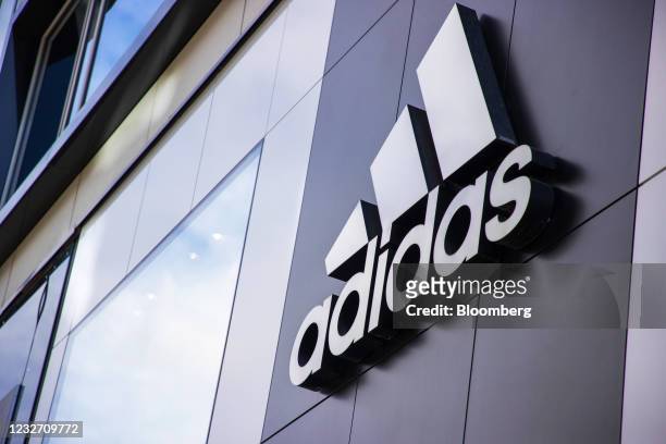 Logo outside an Adidas AG store in Frankfurt, Germany, on Wednesday, May 5, 2021. Adidas reports first quarter earnings on May 7. Photographer: Alex...