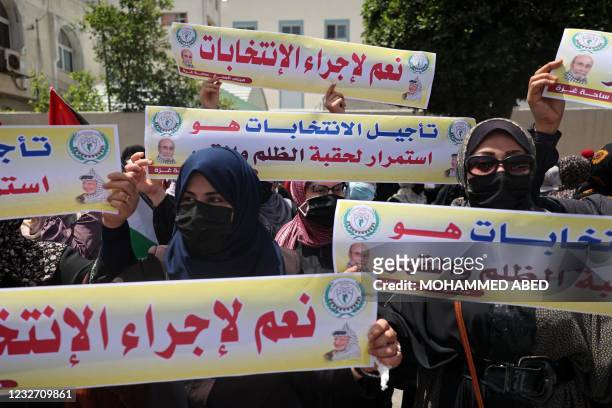Supporters of exiled former Fatah security chief, Mohammed Dahlan, protest the delay of upcoming Palestinian elections in Gaza City on May 5, 2021. -...