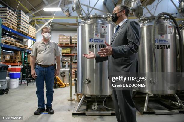 Second Gentleman Douglas Emhoff , with Mike Manning of the Colony Meadery, speaks during a tour of the Bridgeworks Enterprise Center, a small...