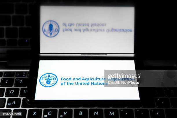 Food and Agriculture Organization of the United Nations logo is displayed on a mobile phone screen photographed for illustration photo. Gliwice,...