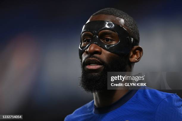 Chelsea's German defender Antonio Rudiger wears a protective face mask during the UEFA Champions League second leg semi-final football match between...