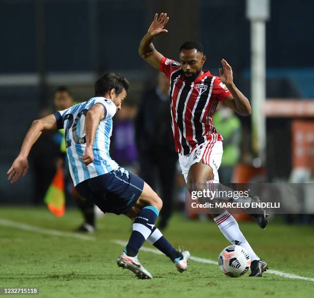 Argentina's Racing Club Dario Cvitanich and Brazil's Sao Paulo William vie for the ball during their Copa Libertadores football tournament group...