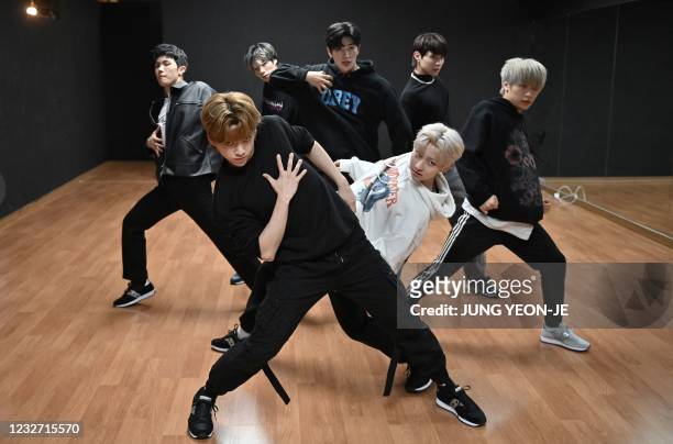 This picture taken on April 29, 2021 shows members of the K-pop boy band Blitzers performing during their dance practise session at a rehearsal...