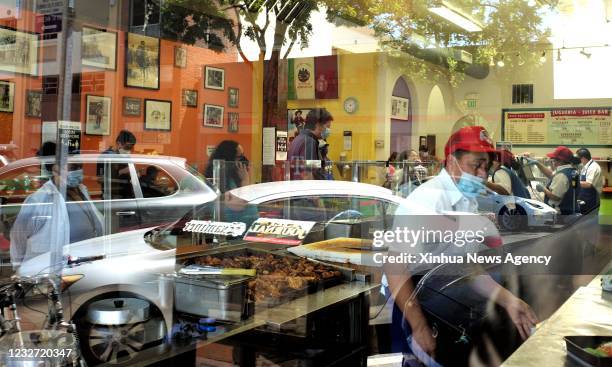 May 5, 2021 -- Customers wait to buy food in a restaurant in San Mateo city, California, the United States, May 5, 2021. San Mateo county, where San...