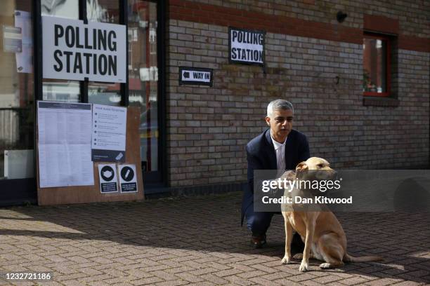 Labour candidate for London Mayor Sadiq Khan with his dog Luna after he accompanied his wife, Saadiya Khan, as she voted at a polling station in...