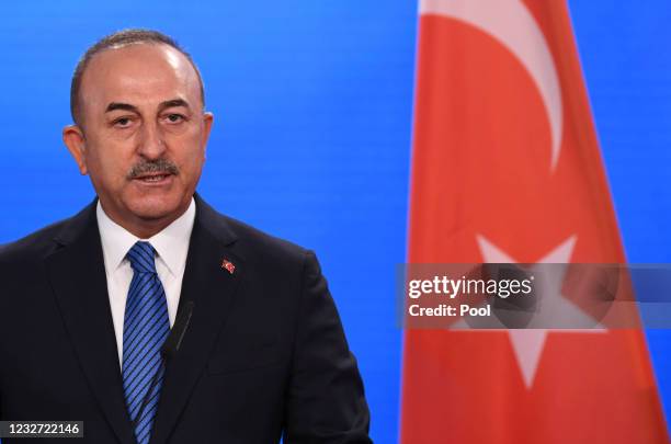 Turkish Foreign Minister Mevlut Cavusoglu gives a statement to the media following a meeting with German Foreign Minister Heiko Maas at the foreign...