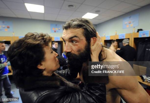 France's Sports minister Roselyne Bachelot kisses France's lock Sebastien Chabal in the lock room after the rugby union test match France vs...