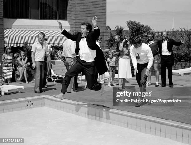 Cricket photographer Graham Morris is pushed into the hotel swimming pool by England cricketer Allan Lamb as the England team and their families...