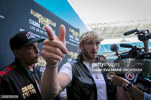 Youtuber Logan Paul gestures as he talks during a press conference at Hard Rock Stadium, in Miami Gardens, Florida, on May 6, 2021. Former world...