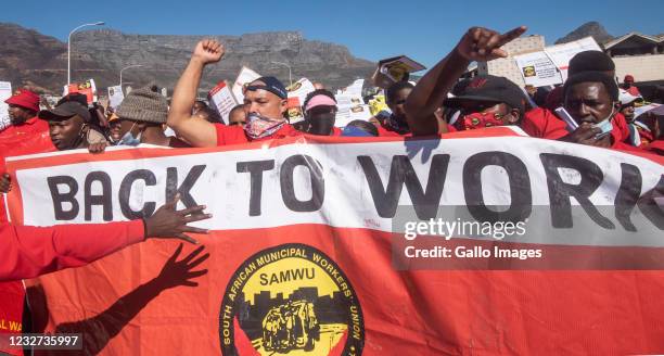 Protesters march to Cape Town Civic Center during the Back To Work Campaign on International Workers Day on May 01, 2021 in Cape Town, South Africa....