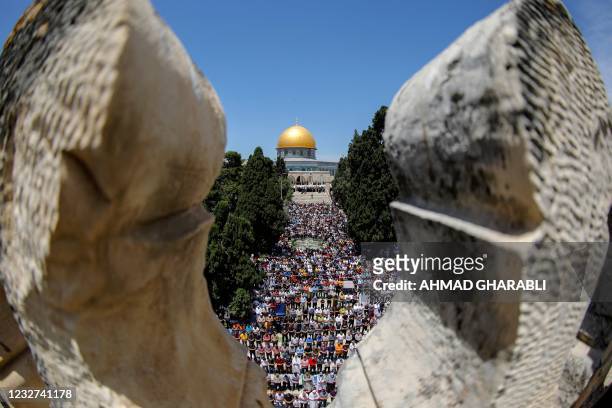 Palestinians gather to perform the last Friday prayers of the Muslim fasting month of Ramadan, outside the Dome of the Rock mosque at the al-Aqsa...