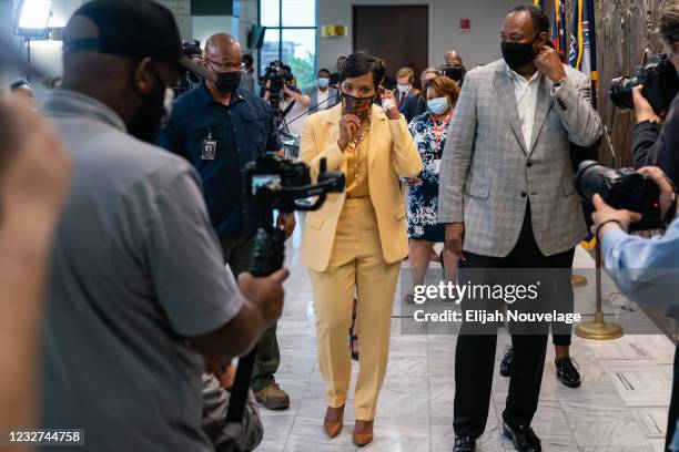 Atlanta Mayor Keisha Lance Bottoms and her husband Derek Bottoms leave a press conference at City Hall following her announcement that she will not...