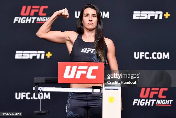 In this UFC handout, Marina Rodriguez of Brazil poses on the scale during the UFC weigh-in at UFC APEX on May 07, 2021 in Las Vegas, Nevada.