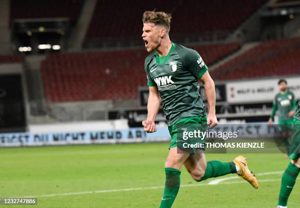 Augsburg's German forward Florian Niederlechner celebrates after scoring the 1-1 goal during the German first division Bundesliga football match VfB...