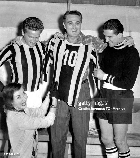 Juventus player Giampiero Boniperti with teammates and Lauretta Masiero in dressing room during a portrait session on 50's in Turin, Italy.