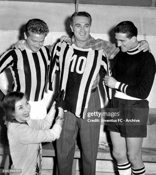 Juventus player Giampiero Boniperti with teammates and Lauretta Masiero in dressing room during a portrait session on 50's in Turin, Italy.