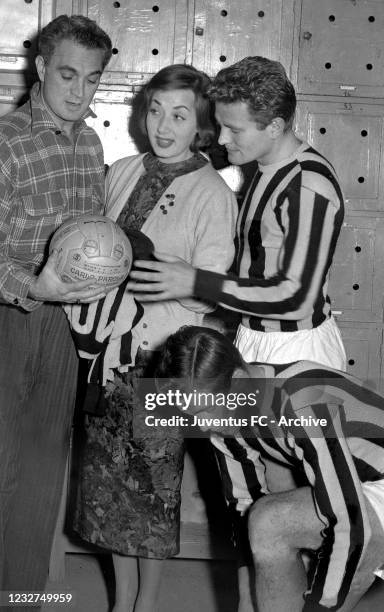 Juventus player Giampiero Boniperti with teammates and Lauretta Masiero in dressing room during a portrait session on 50's in Turin, Italy.