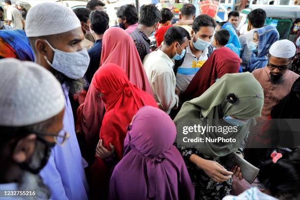 People gather at Dhaka New market for shopping ahead Eid-ul-fitr as they are not maintaining any kind of social distancing in Dhaka, Bangladesh on...