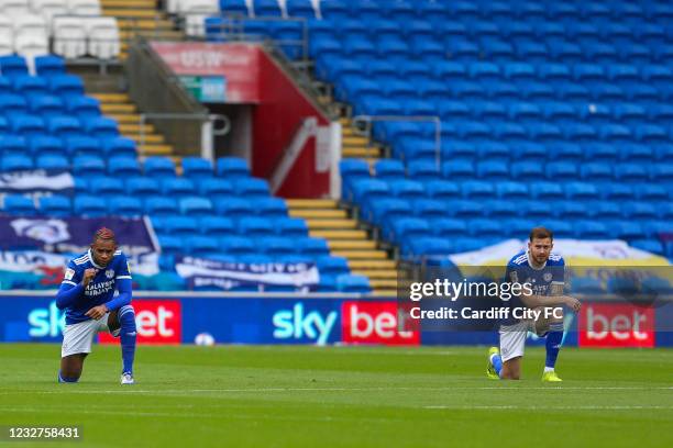 Leandro Bacuna and Joe Ralls of Cardiff City FC take a knee during the Sky Bet Championship match between Cardiff City and Rotherham United at...