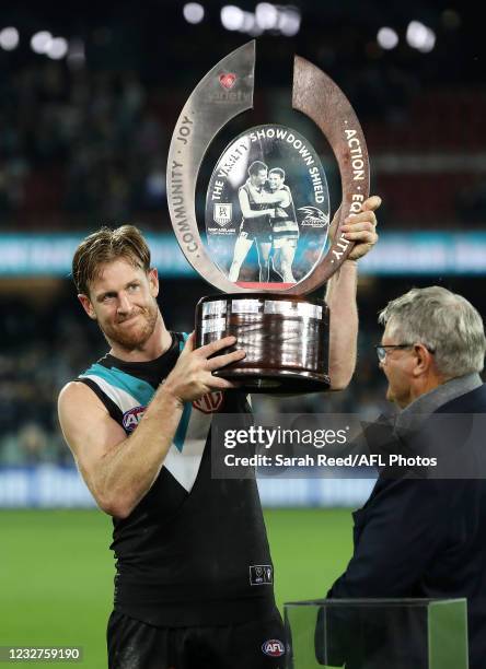 Tom Jonas of the Power with the Showdown Trophy during the 2021 AFL Round 08 match between the Port Adelaide Power and the Adelaide Crows at Adelaide...