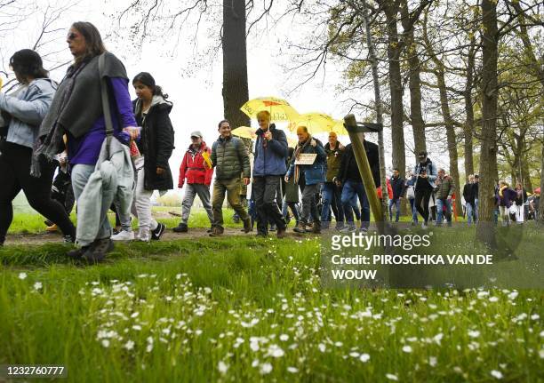 Protesters take part in a march for the human connection, organized by the Police For Freedom Netherlands movement in Barneveld on May 8 calling on...
