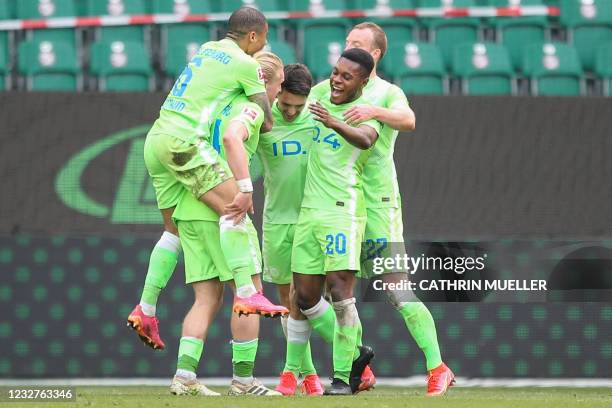 Wolfsburg's Croatian midfielder Josip Brekalo celebrates scoring the 2-0 goal with his teammates during the German first division Bundesliga football...