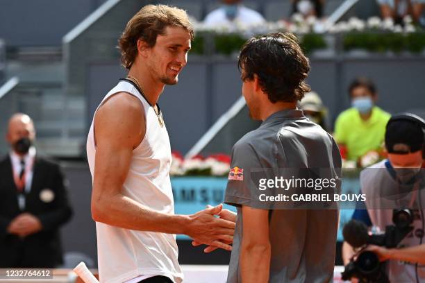 Germany's Alexander Zverev shakes hands with Austria's Dominic Thiem after their 2021 ATP Tour Madrid Open tennis tournament singles semi-final match...