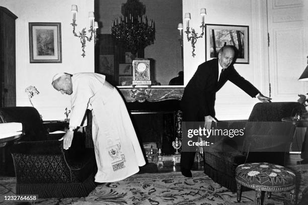 Pope John Paul II meets French President Valery Giscard d'Estaing at the Elysee Palace in Paris during his official visit in France on May 31, 1980.