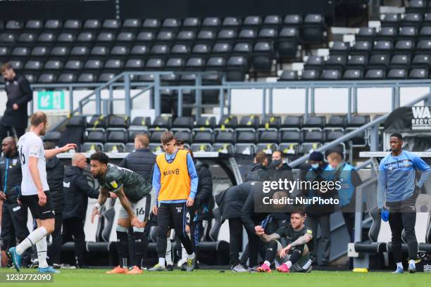 Wayne Rooney, Derby County manager, consoles Josh Windass of Sheffield Wednesdayduring the Sky Bet Championship match between Derby County and...