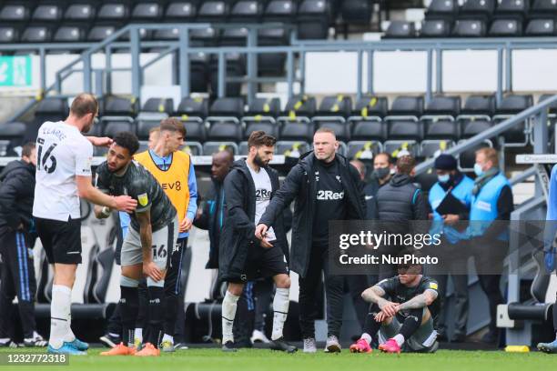 Wayne Rooney, Derby County manager, consoles Josh Windass of Sheffield Wednesdayduring the Sky Bet Championship match between Derby County and...