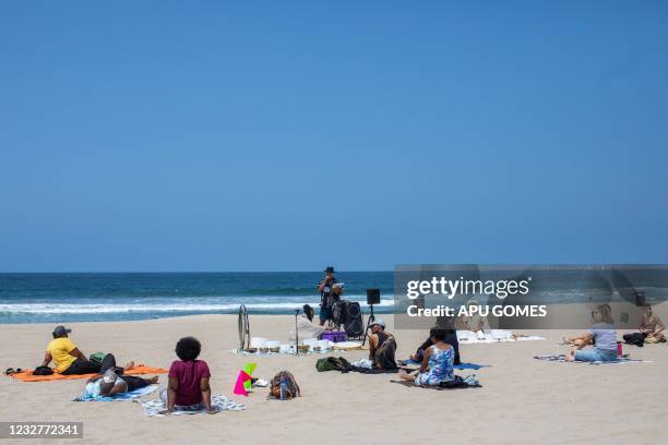 Tyson Suzuki speaks to activits while they practice breath work and meditation in a peacefull protest at Bruce's Beach on May 8, 2021 in Manhattan...