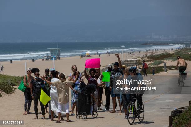 Activists gather in a peacefull protest at Bruce's Beach on May 8, 2021 in Manhattan Beach, California. - The Los Angeles County Board of Supervisors...