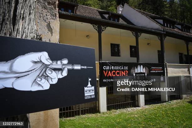 Banner reading in Romanian "Who's afraid of vaccine" and depicting syringes as vampire fangs advertises the vaccination marathon organised at the...