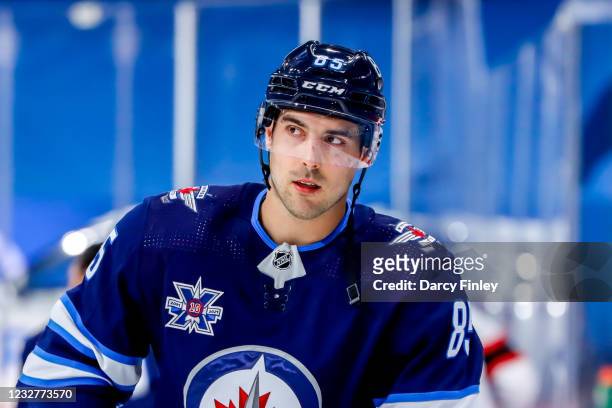 Mathieu Perreault of the Winnipeg Jets looks on during the pre-game warm up prior to NHL action against the Ottawa Senators at the Bell MTS Place on...