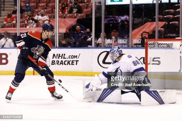 Goaltender Andrei Vasilevskiy of the Tampa Bay Lightning stops a shot by Alexander Wennberg of the Florida Panthers during third period action at the...