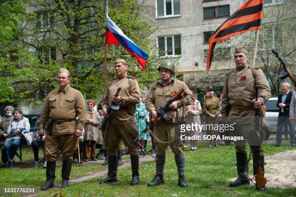Actors in the military uniform of the Soviet Army during the Second World War with the Russian flag and St. George ribbon. On May 8 many veterans of...