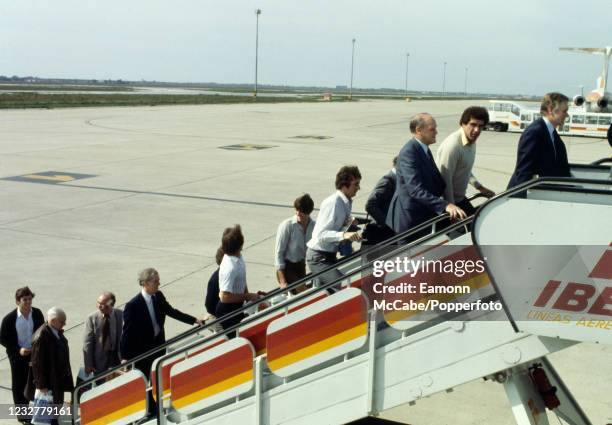 England players and officials boarding the aeroplane heading home, the day after beating Spain in an International Friendly on March 26, 1980 in...