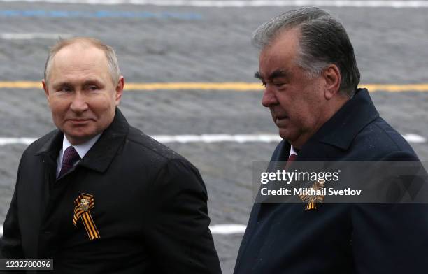 Russian President Vladimir Putin and Tajikistan President Emomali Rahmon attend a military parade at Red Square on May 9, 2021 in Moscow, Russia....