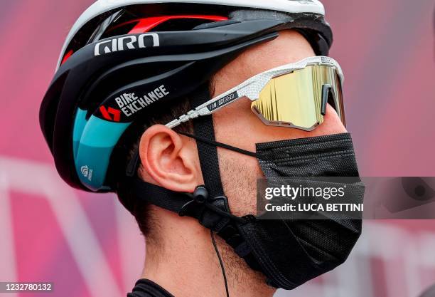 Team BikeExchange rider Great Britain's Simon Yates looks on as he poses with riders of his team on stage prior to the start of the second stage of...