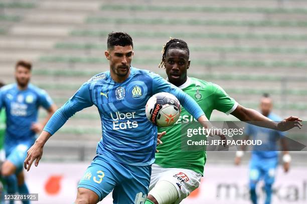 Marseille's Spanish defender Alvaro Gonzalez vies for the ball with Saint-Etienne's French forward Charles Abi during the French L1 football match...